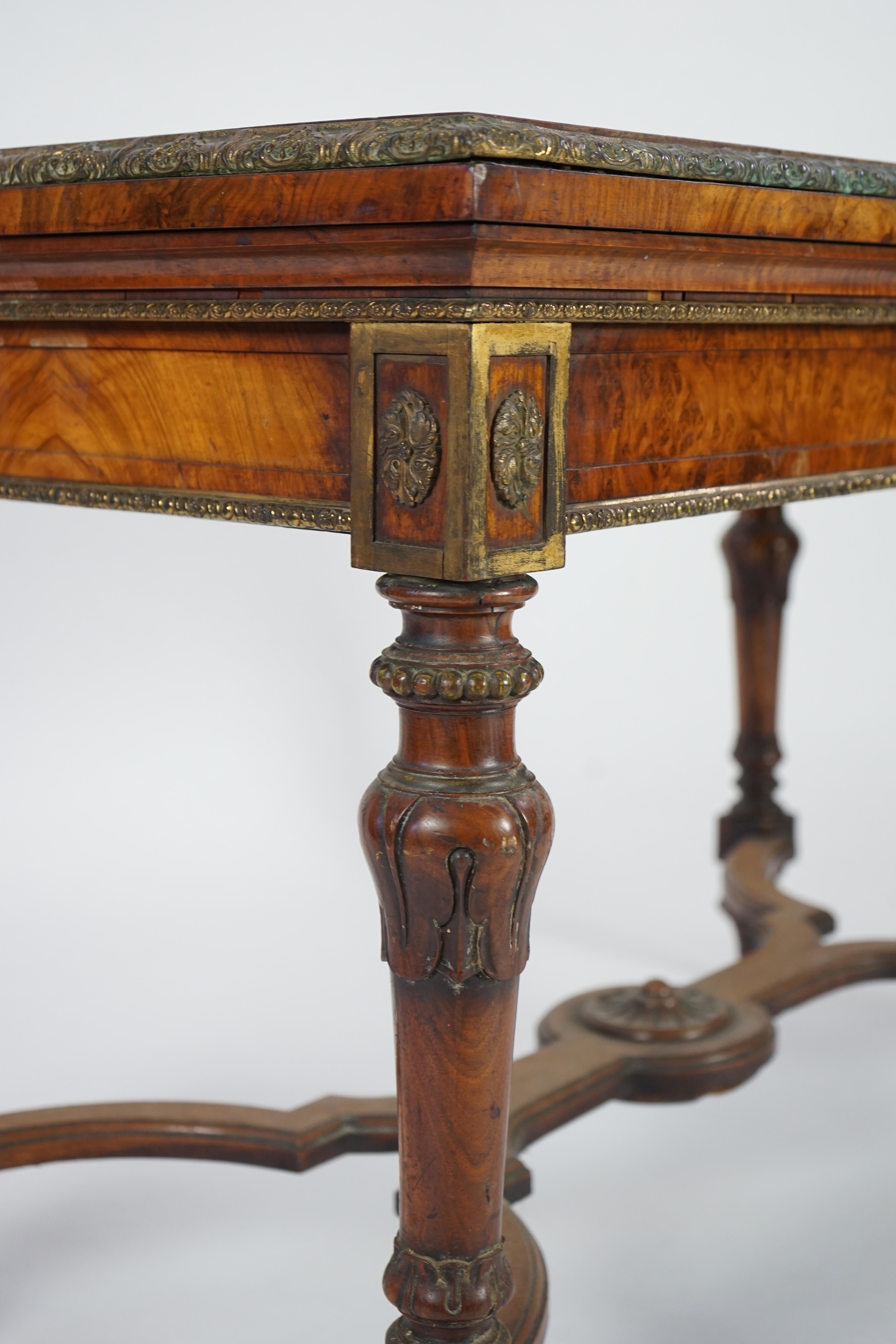 A mid Victorian ormolu mounted walnut pietra dura top centre table